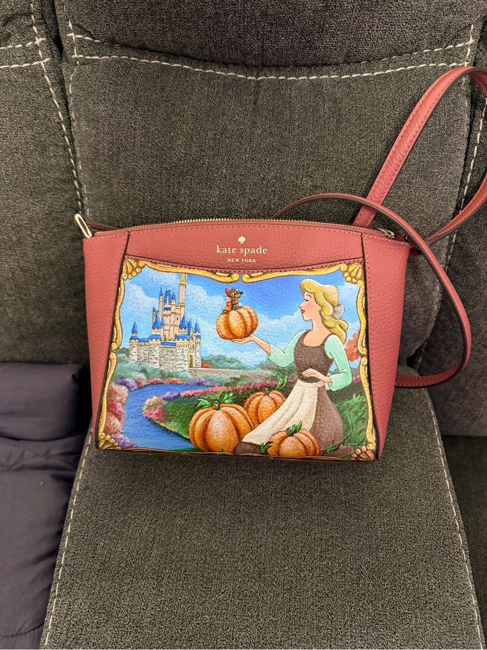 kate spade dusty rose crossbody with Cinderella pumpkin scene